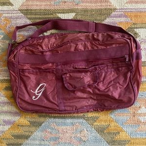Vintage maroon bag with monogrammed “g”